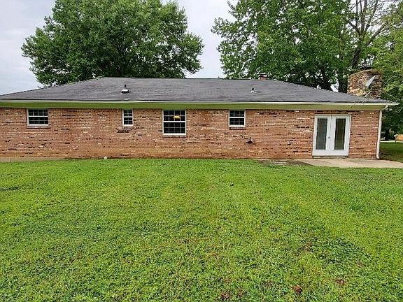 Great back patio for your grill, with french doors right off of the Family Room with wood-burning fireplace.