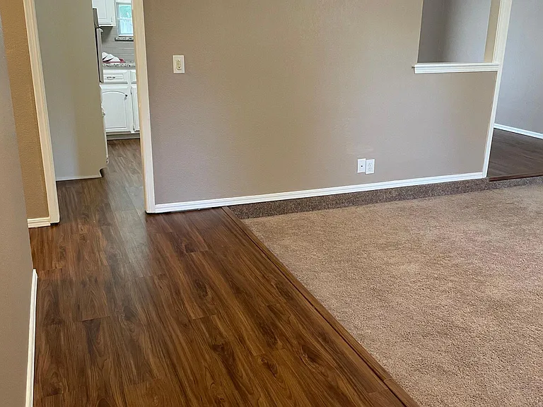 kitchen straight ahead, living room to the right