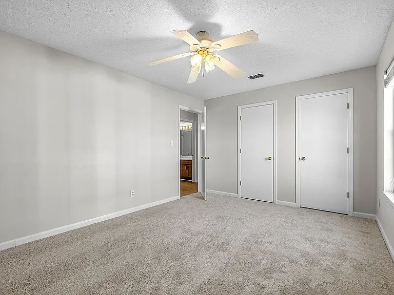 Large second bedroom with wall to wall closets
