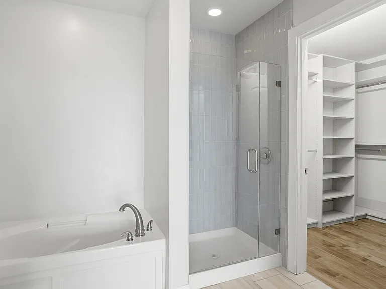 Primary bath with large custom walk in closet