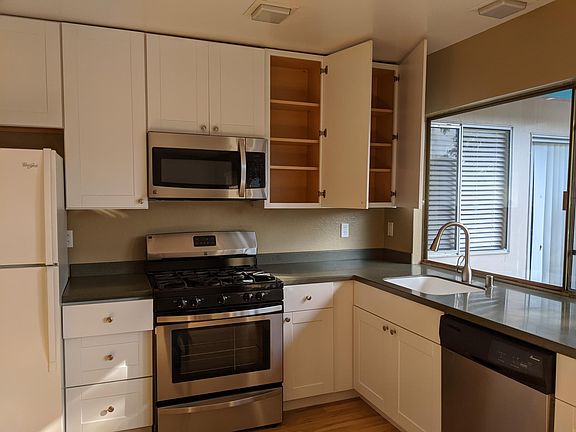 Corian Countertops & Recently Renovated Kitchen Laminate Flooring