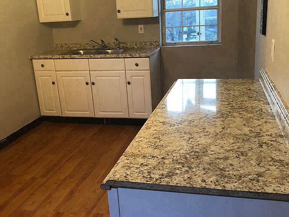 Brand new counters, cabinets and kitchen sink.