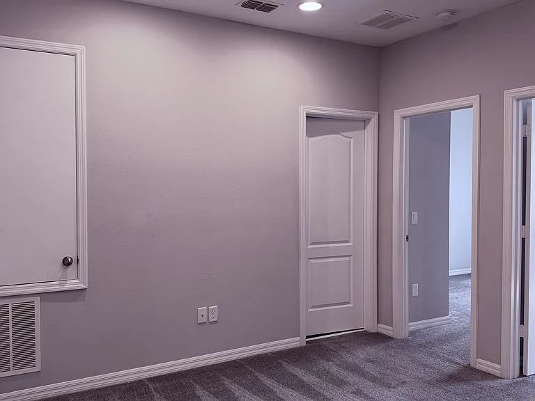 Loft showing entrances to full bathroom and two bedrooms