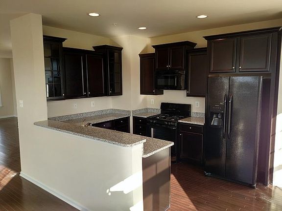 Updated kitchen and stainless steel appliances and gas stove