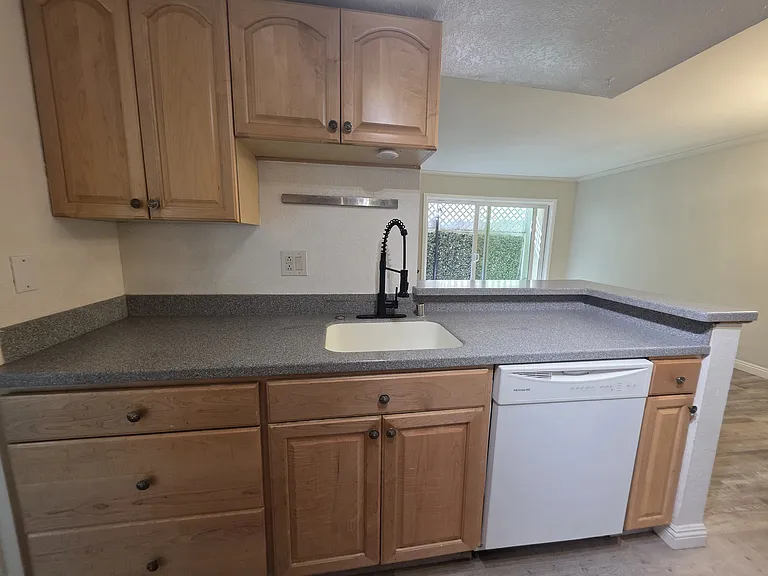 Open concept kitchen views to living room
