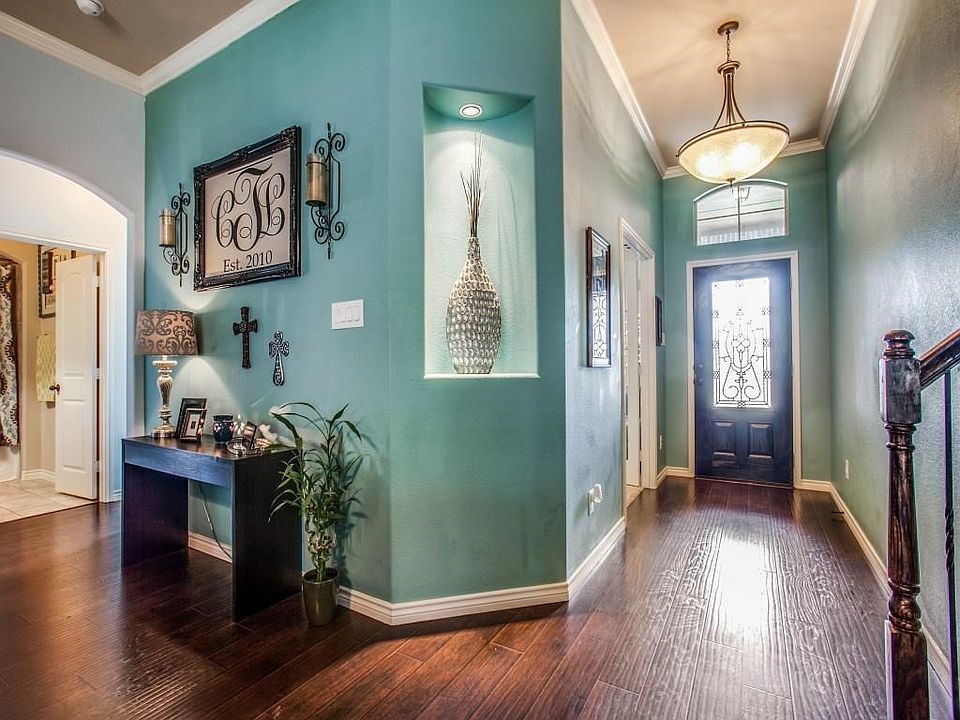 Gorgeous entry! Wood floors from entry through living room.
