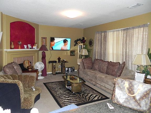  From Foyerb you enter into this lovely Living Room. Has Tile surround fireplace