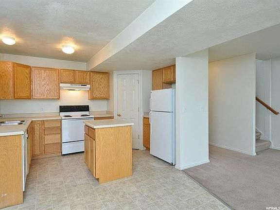 Kitchen with island, dishwasher and pantry