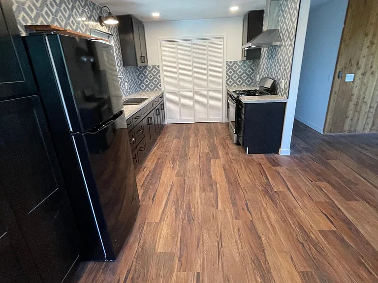 Large kitchen with plenty of cabinets.