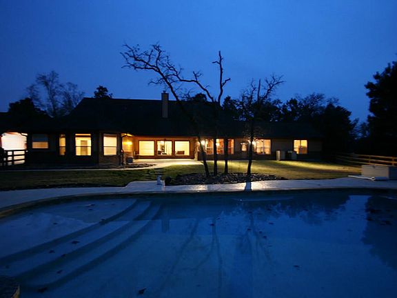 Awesome view of back of house with over sized salt water pool
