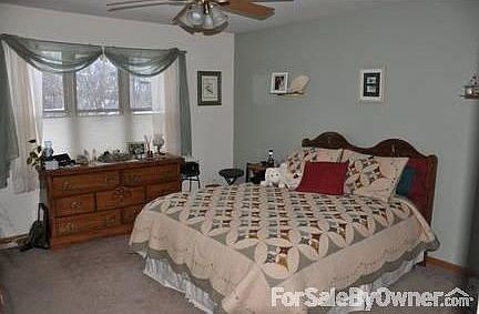 Master Bedroom : Adjoining bath has his and hers sinks. A walk-in closet adds the finising touch.