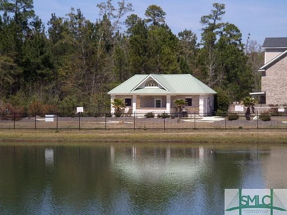 view of pool area from lake