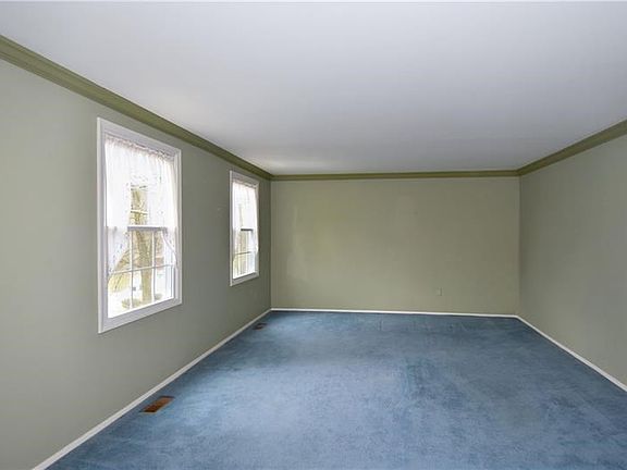 Entertain guests in the spacious living room with crown molding.