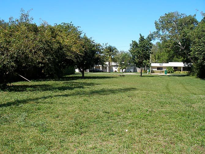 This Lot For Sale In Biscayne Gardens, FL Has A Canal on the Back