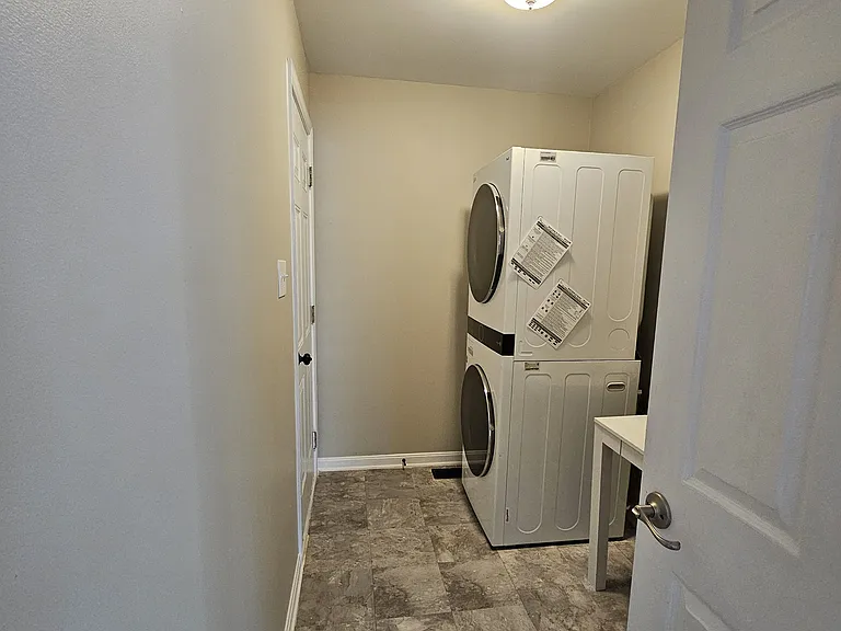 Laundry room attaches to two car garage.