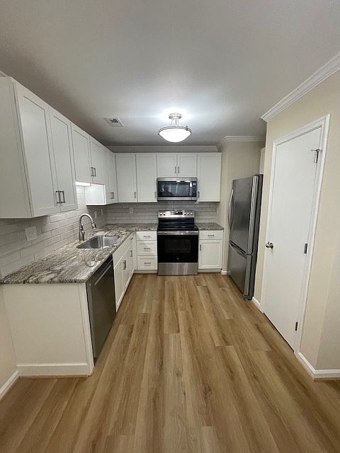 Kitchen with new cabinets, granite countertops, flooring and new appliances