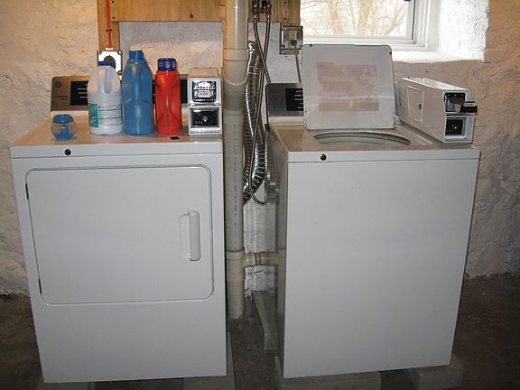 coin op laundry in basement