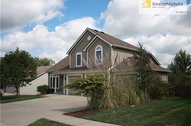 large 3 car garage and nice landscape