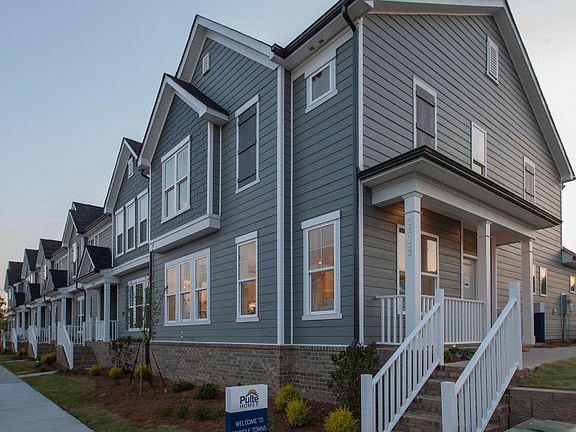 Sharon Exterior 21B features siding, shakes, covered front door and 2-car rear load garage