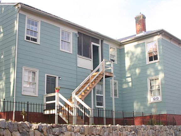 Side of house to private entrances (2 stair steps, no rails)