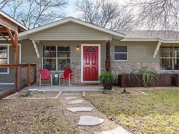 Custom planters and cute front porch greet you
