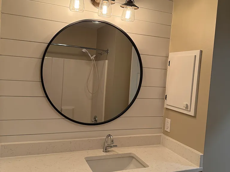 Bathroom 2 with newly built in cabinets, and quartz countertop.