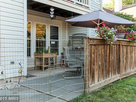 Convenient Terrace level partially fenced w/ Patio