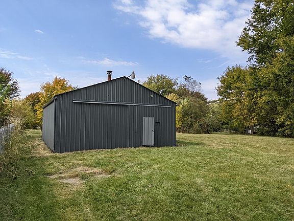 Rear yard pole building in a very large back yard