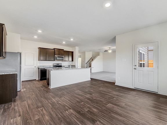 The dining room is open to the kitchen and family room.