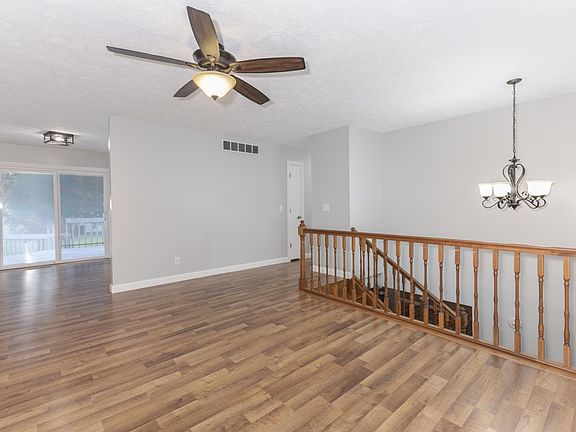 Upper level living room with excellent natural light.