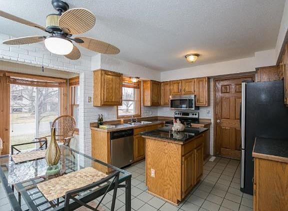 Eat-in kitchen. New dishwasher, stainless appliances and granite island. Open and bright.