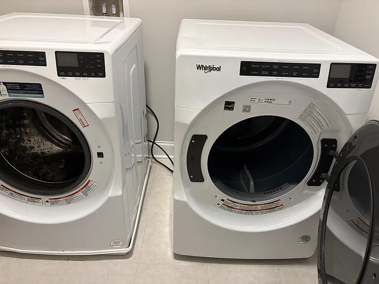 Convenient in-home laundry area with a full-size front-load washer and dryer for easy, anytime cleaning.