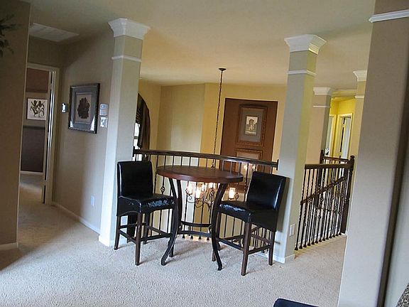 A Glimpse of the conversational area from the game room! Secondary bedroom to the left and