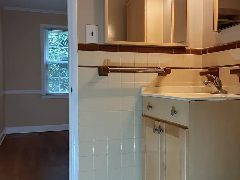 Primary bathroom off of primary bedroom w/full tiled shower.