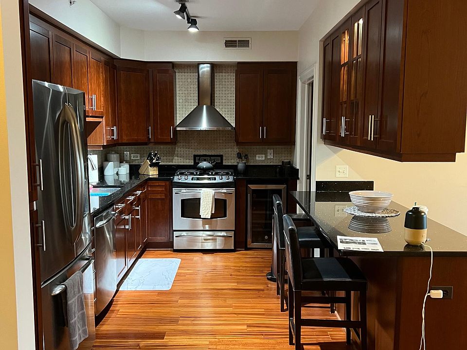 Kitchen has more cabinet space than you need.