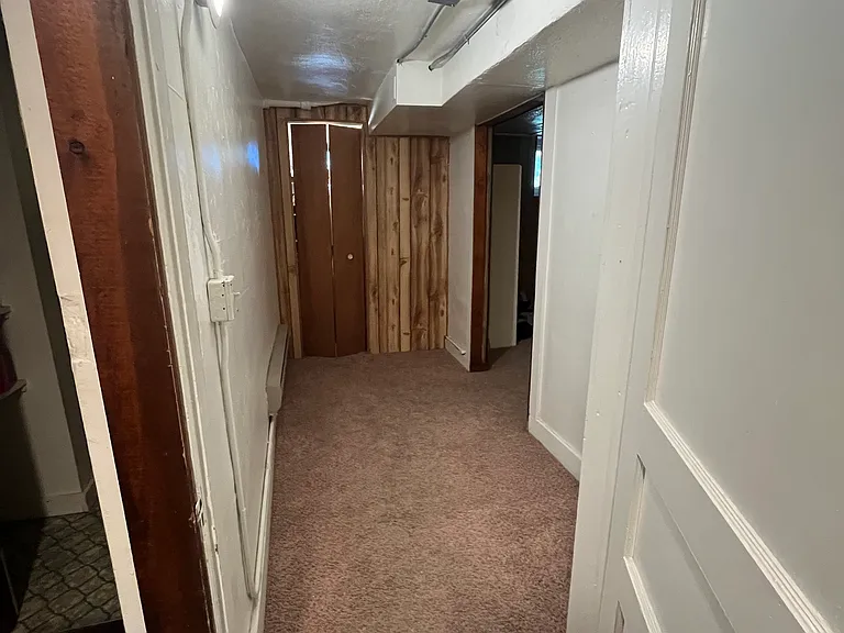 Hallway with closet and storage space