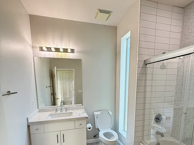 Guest Bathroom: Brand New Quartz Countertop and Elongated Toilet