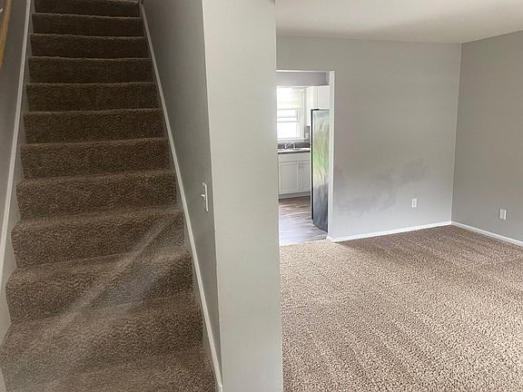 As you walk through the front door, you are greeted with a stair case to your left and the large open living room to your right