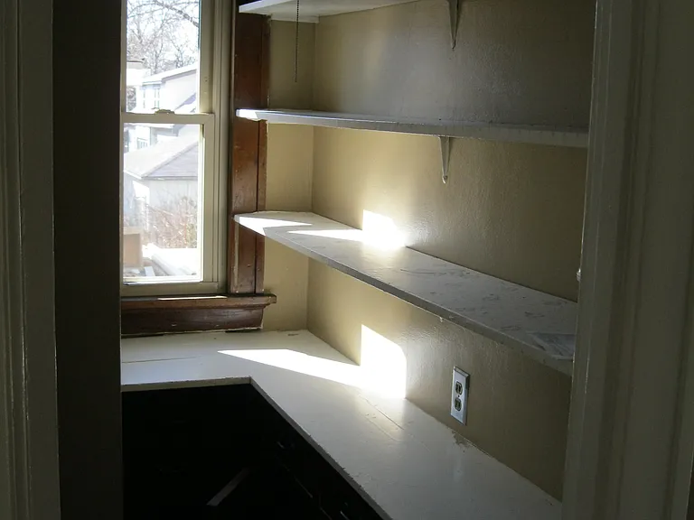 Large kitchen pantry with plenty of storage space.