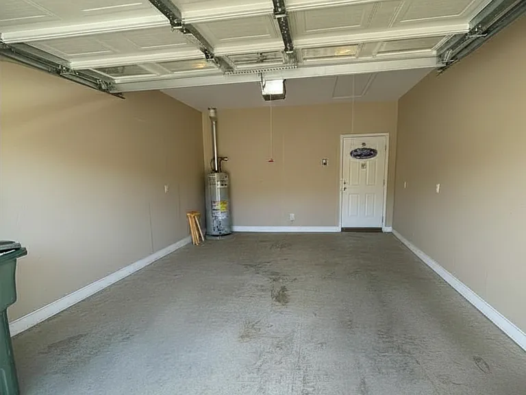 Garage with plenty of room for a car and storage.