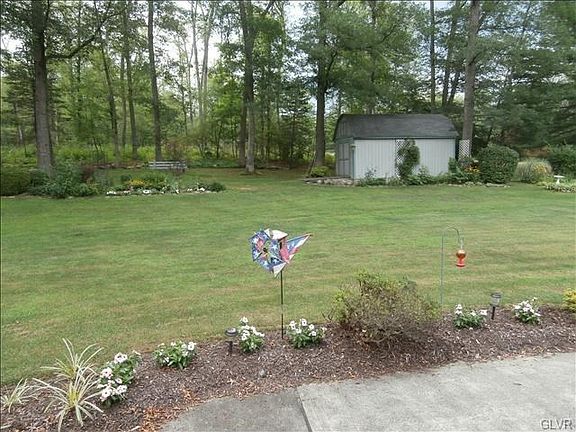 Rear yard with plenty of room for your picnics and gardens. Large storage shed built by Vo-Tech.