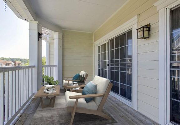 Oversized Balcony with sliding glass doors that you can access from the living room or the primary bedroom.