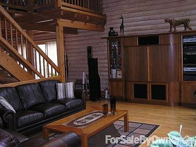 open concept family room
						:
						maple hardwood flooring