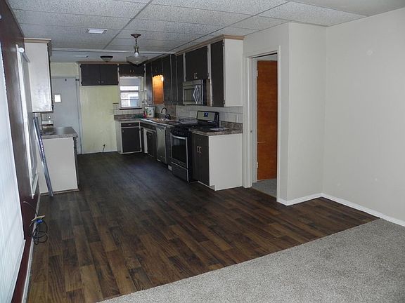 Front entry/ dining/ kitchen. Door on the right side of phot