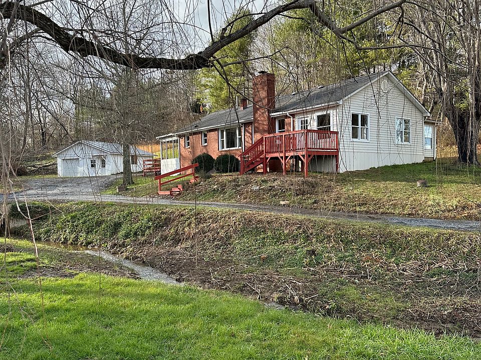 View from street of Cottage and garage