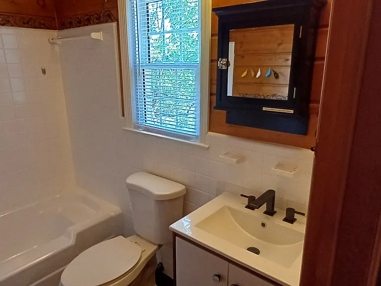 2nd floor bathroom. Luxuriate in the newly glazed tub. Here or downstairs.