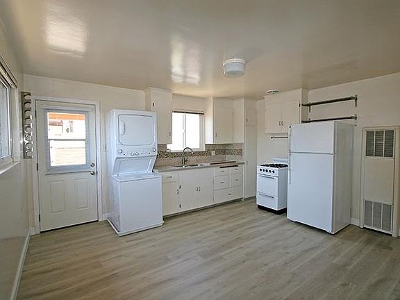 Combined kitchen and living space. Bedroom is just off to the right side.