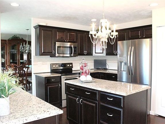 Kitchen with granite countertops and so much storage
