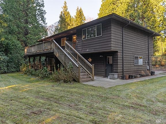 CEDAR SIDED HOME WITH OVERSIZED TREX DECK