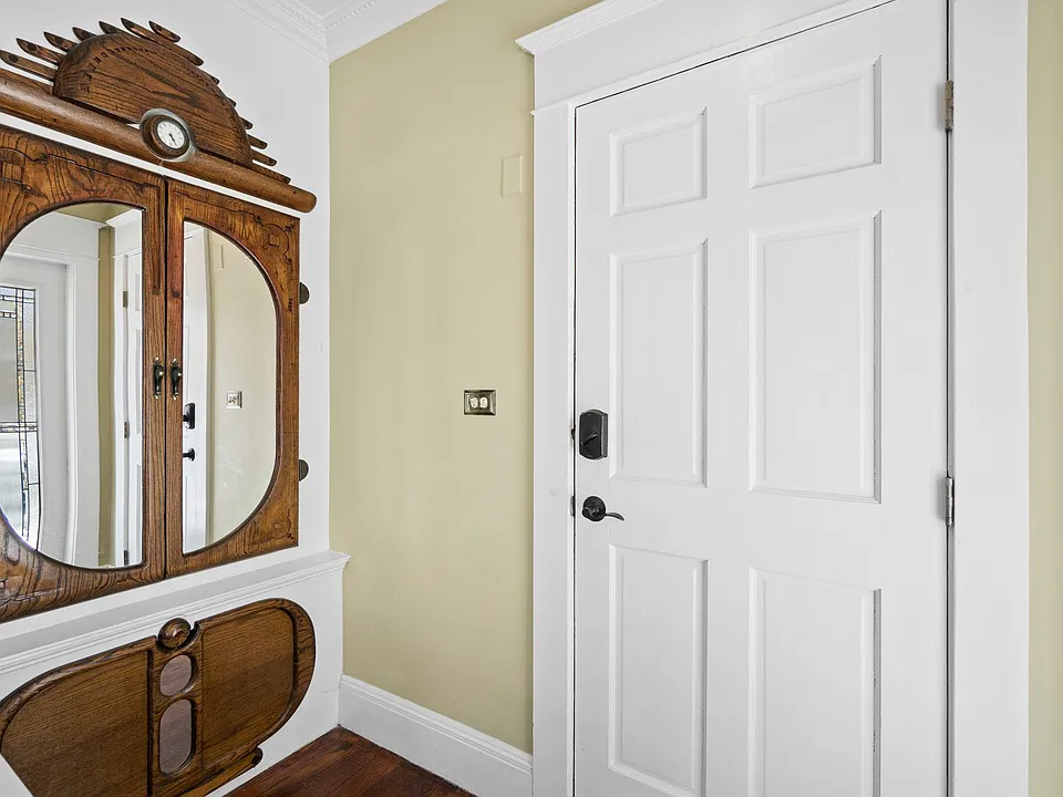 Built-in coat and shoe storage just inside the entrance to the unit.